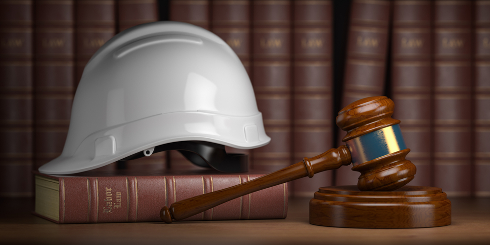 Construction helmet and legal gavel 