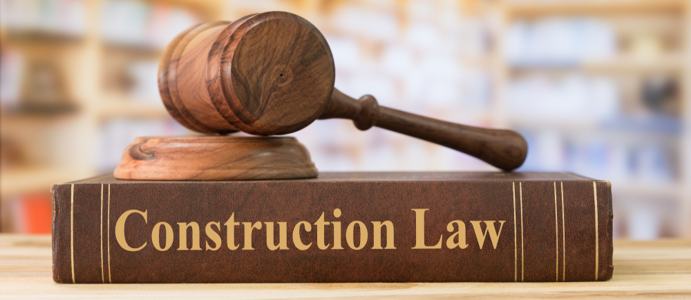 Legal gavel on a book reading construction law