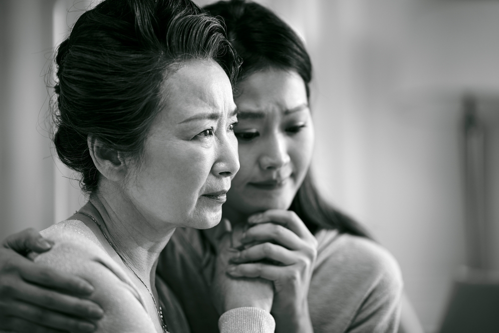Mother and daughter grieving 
