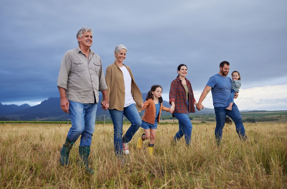 Family walking together in a field