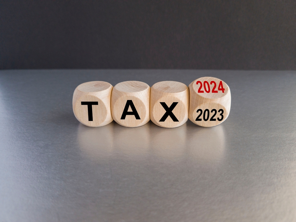 wooden blocks with the word tax and one that says 2024